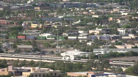 Cargo Train and Busy Freeway Stock Footage 83293164