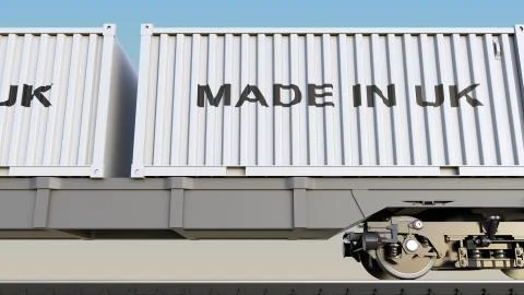Cargo train and containers with MADE IN UK caption. Railway transportation. 3D Stock Illustration