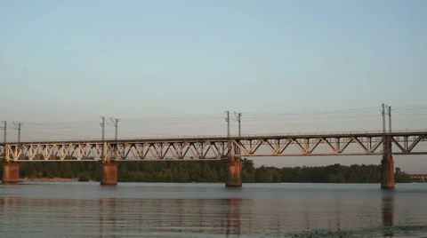 Cargo train on the bridge crossing the river Stock Footage 47707004