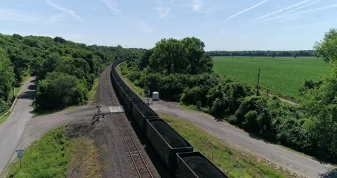 Cargo train carrying coal through rural Kansas, aerial drone shot Stock Footage 167362871