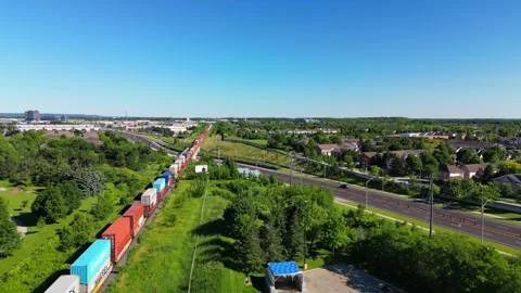 Cargo train with containers traveling through Burlington, Ontario, Canada Stock Footage 342341226