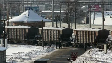 Cargo train on cross road in winter city Stock Footage 10798727