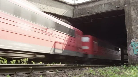 Cargo train exiting tunnel Stockbeeldmateriaal 76014965