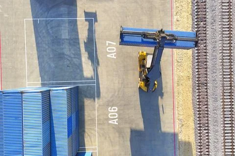 This is a cargo train with a freight container. It is part of the business of Stock Photos