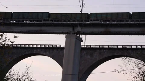 Cargo train goes to the railway bridge. Stock Footage 141481663