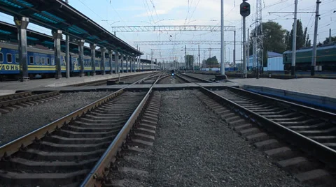 Cargo train is passing by, camera is moving slowly between tracks Stock Footage 34839582