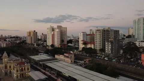 Cargo train passing by downtown in Latin America Stock-Footage 156076622