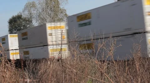 Cargo train passing by dry land Stock Footage 44725637