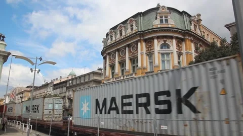 Cargo train is passing in front of Rijeka City Library building, Croatia Stock Footage 336578178