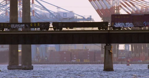 Cargo train passing over the Newark Bay Bridge Video stock 51296919