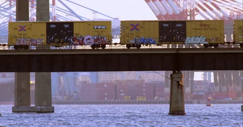 Cargo train passing over the Newark Bay Bridge Video stock 51297824