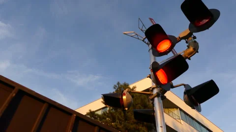 Cargo train passing red signal lights Stock Footage 67193534