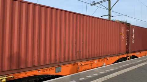 Cargo train is passing through passengers platform at Tilburg train station Stock Footage 171924782