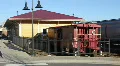 Cargo Train Passing By The Train Station HD Footage