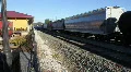 Cargo Train Passing By The Train Station HD Footage