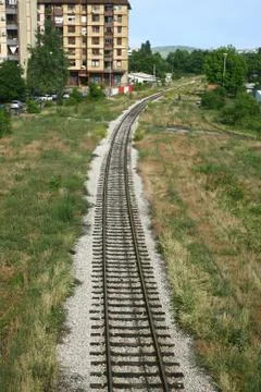 Cargo train platform railway tracks in a rural scene Stock Photos