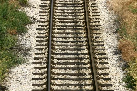 Cargo train platform railway tracks in a rural scene Stock Photos
