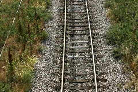 Cargo train platform railway tracks in a rural scene Stock Photos