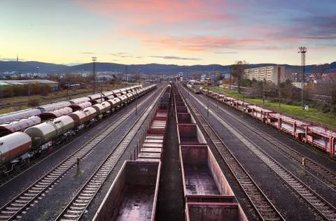 Cargo train platform at sunset with container Stock Photos