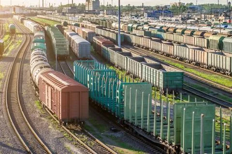 Cargo train platform at sunset with container. Stock Photos
