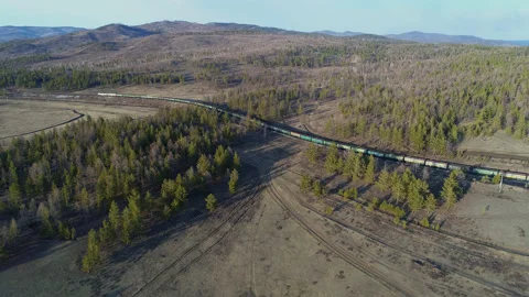 Cargo train in polar forests. Transportation of hard coal for heat generation at Stock Footage 203919820