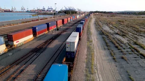 Cargo train at a the port of Long Beach | Aerial Ascending Flight Stock Footage 160313305