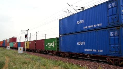 Cargo train, Railway freight train of cargo shipping containers passing throug Stock Footage