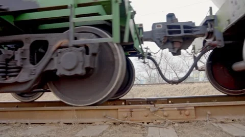 Cargo train rides on railroad moving slowly by rail at the station Stock-Footage 266383472