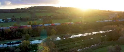 Cargo train at sunset Stock Footage