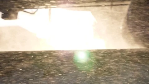 Cargo train wheels run, sun flash between bogie, winter season, snow flakes fly Video stock 84267881