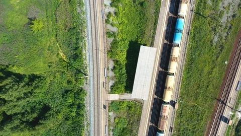 Cargo trains close-up. Aerial view of colorful freight trains on railway station 스톡 동영상 112950180