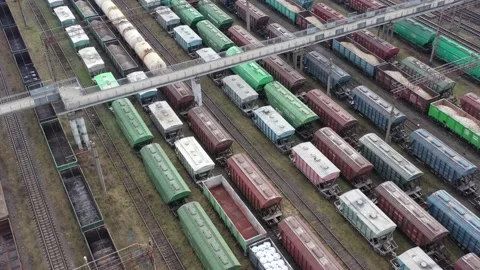Cargo trains close-up. Aerial view of colorful freight trains Stock Footage 167840464