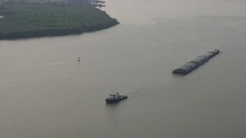 Cargo transport ship passing in river. at sunset time. Stock Footage 84444799