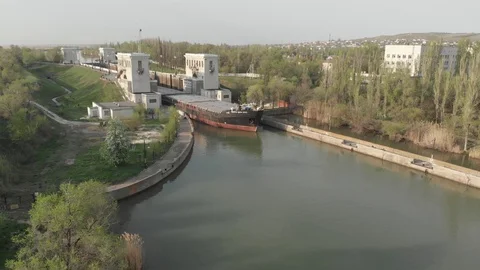 Cargo transportation by water. The cargo ship leaves the airlock. Stock Footage 111387723