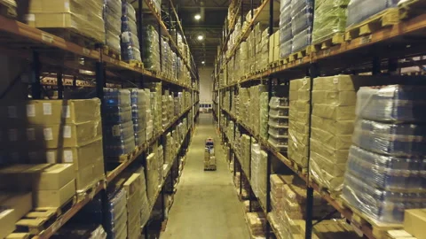 Cargo is transported in the warehouse. Stock Footage 99534059