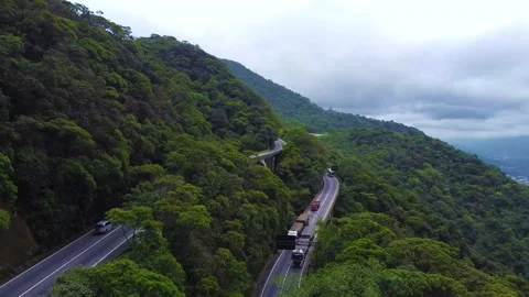 Cargo trucks heading to Sao Paulo on a mountainous road, Brazil, 4k Stock Footage 169814417