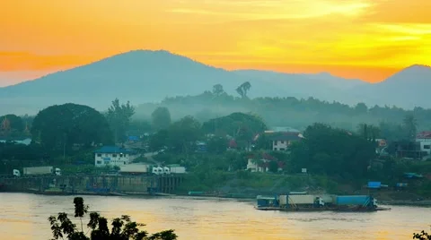 Cargo Trucks on River Barge at Sunset in Laos Stockbeeldmateriaal 47856048