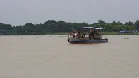 A cargo vessel is crossing the river Stock Footage 314511332