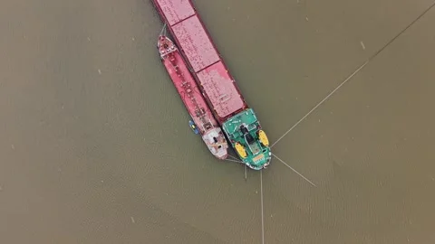 Cargo vessel is docked at shipyard for loading and unloading tasks 動画素材 337941134