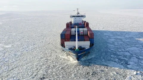 Cargo vessel goes through the ice floes. aerial view of front side of ship Stock Footage 170384936