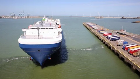 Cargo Vessel leaving the harbor Stock Footage 87175579