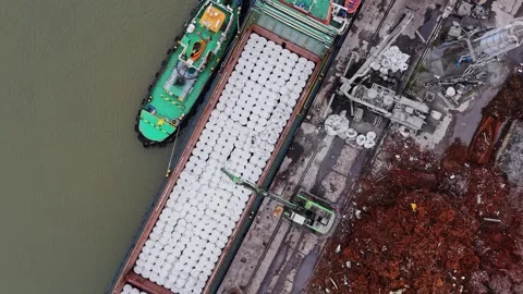 Cargo vessel at shipyard loading materials for transport Video stock 337942406