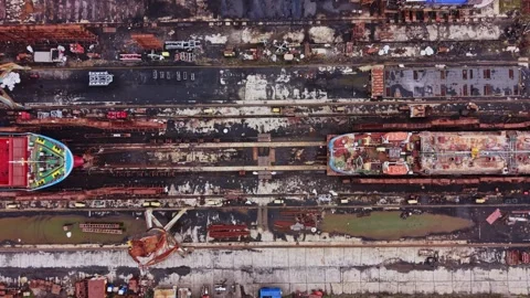 Cargo vessels docked at shipyard for maintenance and loading activities 動画素材 337940858