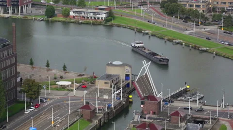 Cargoship passes through a lock on one of channels in Rotterdam Stock Footage 47409216