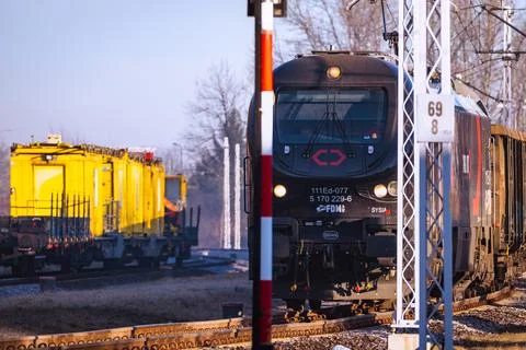 CARGOUNIT Freight Train at a railway yard during a clear winter day in the early Stock Photos