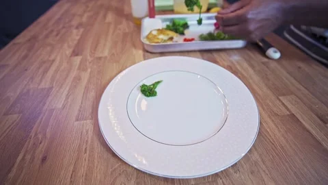 Caribbean chef plating pan seared cod Stock Footage 267008307