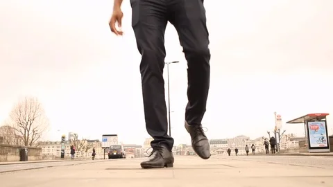 Caribbean man walking down the middle of the road in London during the day Stock-Footage 98738896