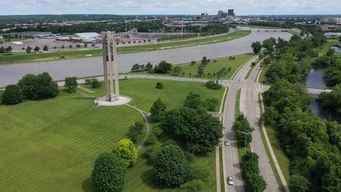 Carillon tower and the Miami River looking toward downtown, Dayton, Ohio, USA Stock Footage 129207352