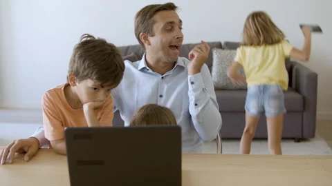 Caring dad talking on smartphone, sitting at table Stock Footage 150774754