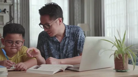 Caring Father Help Son With School Subje... | Stock Video | Pond5